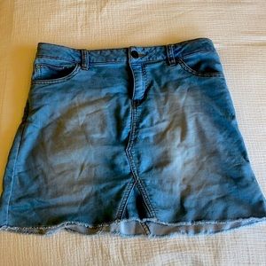 A jean skirt perfect to go to the rodeo or matched with a dress shirt for lunch.